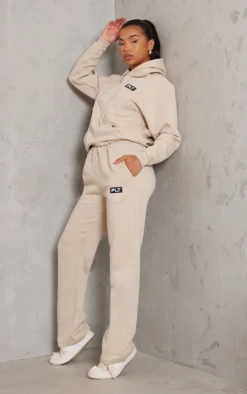 PRETTYLITTLETHING Logo Sand Badge Detail Straight Leg Joggers